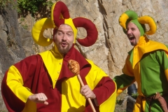 Members of Hauvoy dressed as jesters performing a sketch