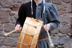 minstrel playing the drum