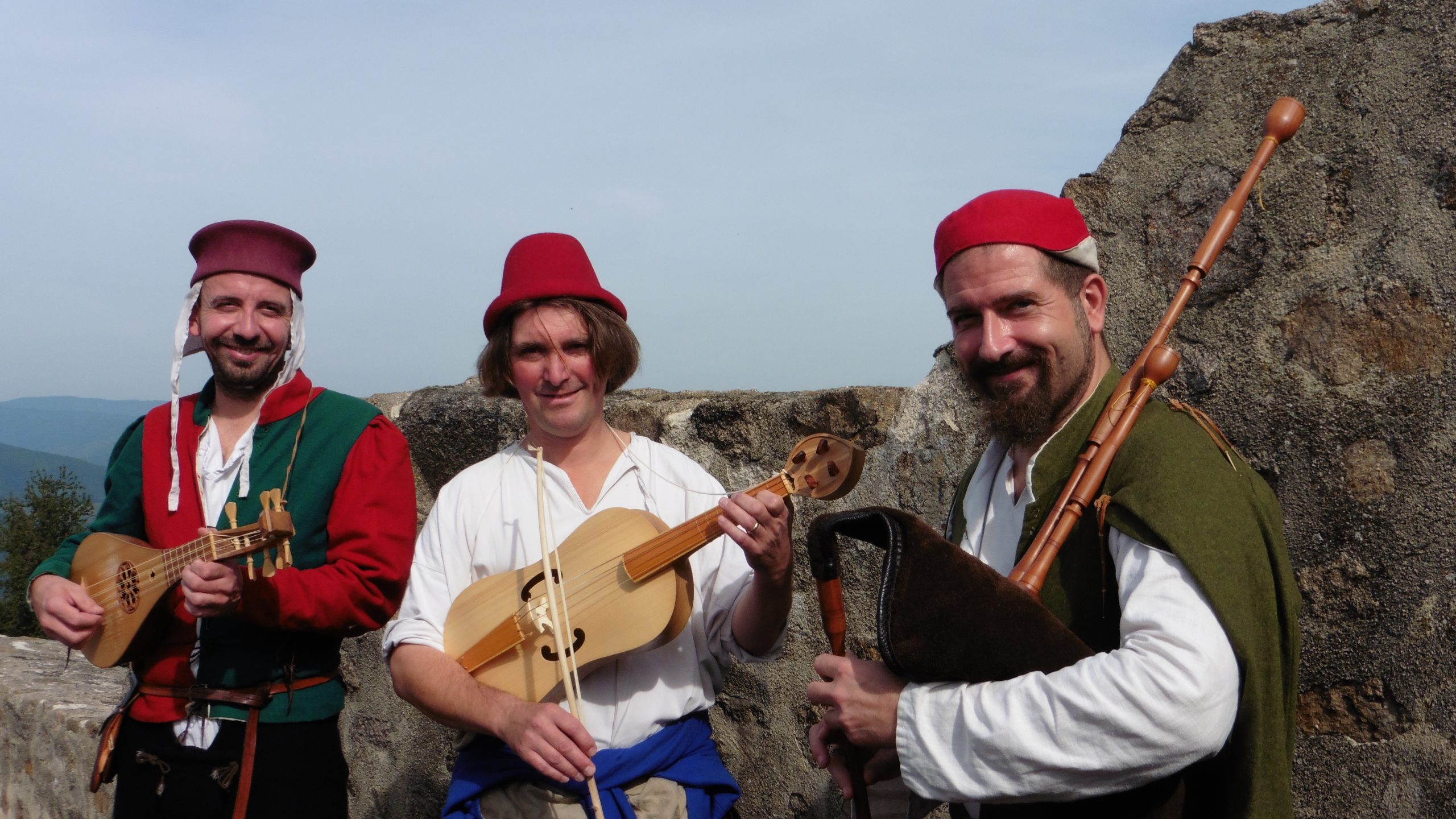 Hauvoy's minstrels posing with their medieval instruments at the Haut-Koenigsbourg's castle